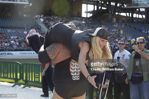 Legends of Wrestling: Rear view of Tyrus carrying Ashley Massaro ringside at Citi Field. Flushing, NY 6/7/2015 CREDIT: William Baker