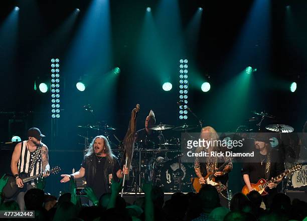 Musicians Brantley Gilbert, Johnny Van Zant, Rickey Medlocke, and Gary Rossington perform onstage during CMT Crossroads: Lynyrd Skynyrd and Brantley...