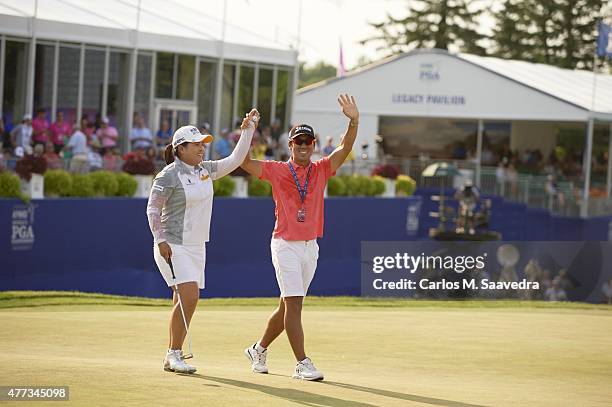 Womens PGA Championship: Inbee Park victorious with her husband and coach Gi Hyeob Nam after winning tournament on Sunday at Westchester CC....