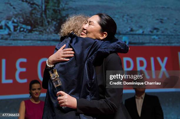 Kazak director Zhanna Issabayeva is awarded the Best Film prize by Claire Denis during the Closing Ceremony of Deauville Asian Film Festival 2014 on...