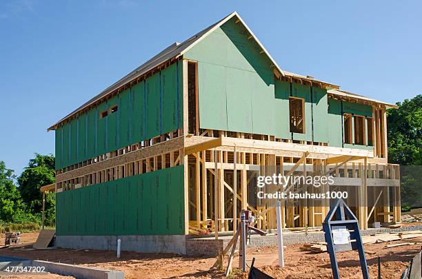 new home under construction - timber window frames stock pictures, royalty-free photos & images