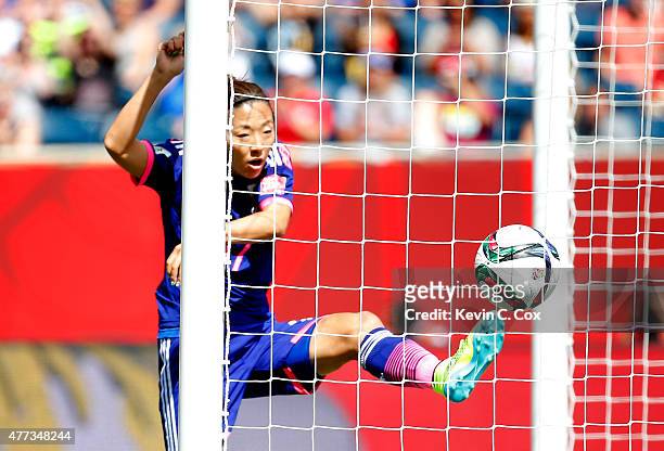 Yuki Ogimi of Japan scores the first goal against Angie Ponce of Ecuador during the FIFA Women's World Cup Canada 2015 Group C match between Ecuador...