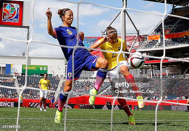 Yuki Ogimi of Japan scores the first goal against Angie Ponce of Ecuador during the FIFA Women's World Cup Canada 2015 Group C match between Ecuador...