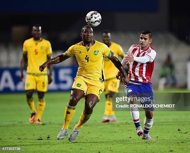 Jamaica's defender Wesley Morgan and Paraguay's forward Derlis Gonzalez vie during their 2015 Copa America football championship match, in...