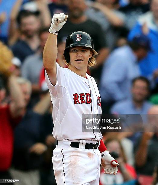 Brock Holt of the Boston Red Sox reacts after hitting a triple to give him the cycle in the eighth inning against the Atlanta Braves at Fenway Park...