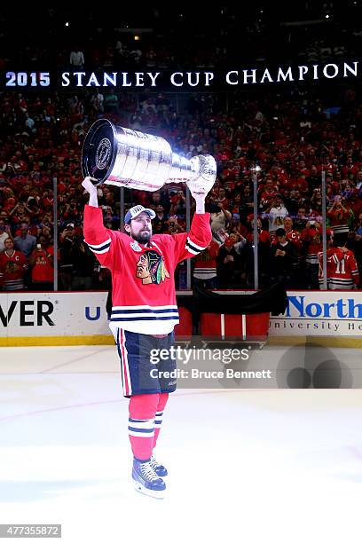 Patrick Sharp of the Chicago Blackhawks celebrates with the Stanley Cup after defeating the Tampa Bay Lightning by a score of 2-0 in Game Six to win...