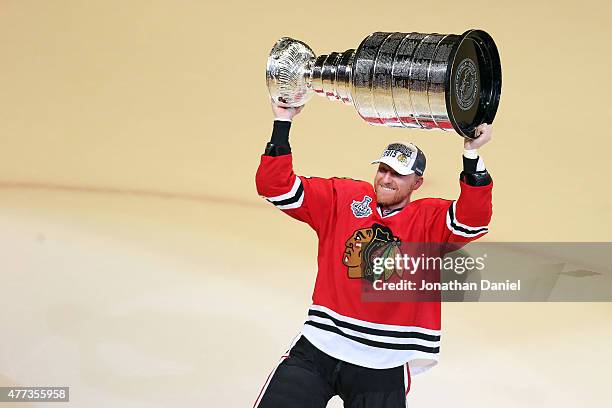 Marian Hossa of the Chicago Blackhawks celebrates with the Stanley Cup after defeating the Tampa Bay Lightning by a score of 2-0 in Game Six to win...