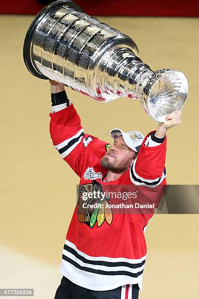 Kimmo Timonen of the Chicago Blackhawks celebrates with the Stanley Cup after defeating the Tampa Bay Lightning by a score of 2-0 in Game Six to win...