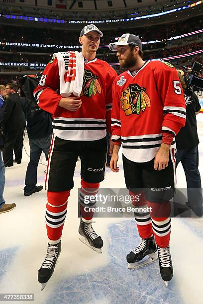 Viktor Svedberg and David Rundblad of the Chicago Blackhawks celebrate after defeating the Tampa Bay Lightning by a score of 2-0 in Game Six to win...