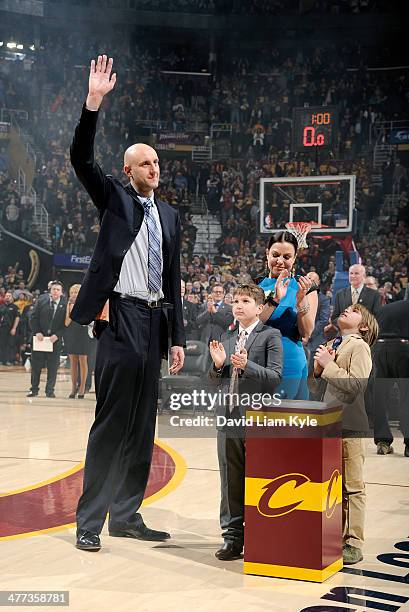 Zydrunas Ilgauskas of the Cleveland Cavaliers retires his jersey during halftime of the game against the New York Knicks at The Quicken Loans Arena...