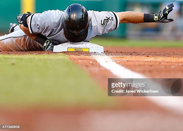 Adam Eaton of the Chicago White Sox gestures with his head on first base after running back to the base following a fly ball in the second inning...
