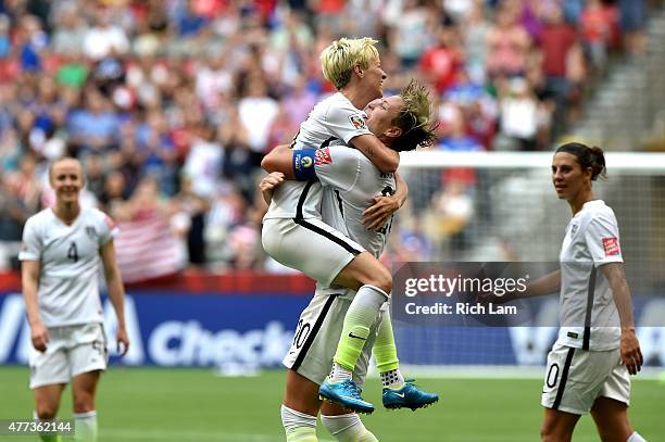 Abby Wambach of the United States celebrates with Megan Rapinoe after Wambach scores a goal in the first half against Nigeria in the Group D match of...