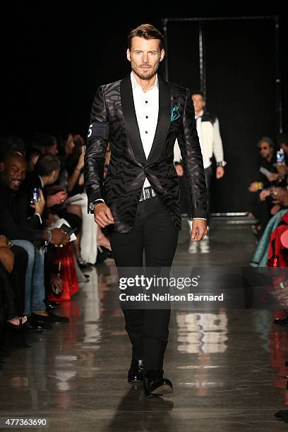 Alex Lundqvist walks the runway at the 2015 amfAR Inspiration Gala New York at Spring Studios on June 16, 2015 in New York City.