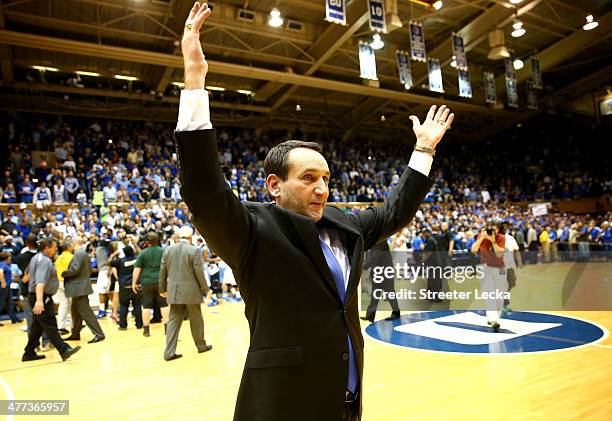 Head coach Mike Krzyzewski of the Duke Blue Devils celebrates after defeating the North Carolina Tar Heels 93-81 at Cameron Indoor Stadium on March...