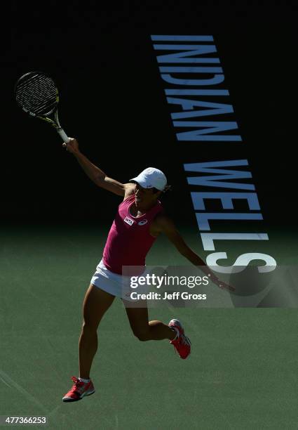 Francesca Schiavone of Italy follows through on a backhand to Samantha Stosur of Australia during the BNP Paribas Open at Indian Wells Tennis Garden...