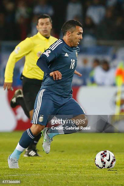 Carlos Tevez of Argentina drives the ball during the 2015 Copa America Chile Group B match between Argentina and Uruguay at La Portada Stadium on...