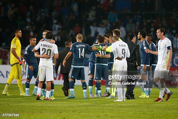 Players of Argentina greet players of Uruguay after the 2015 Copa America Chile Group B match between Argentina and Uruguay at La Portada Stadium on...