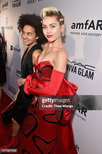 Miley Cyrus and Tyler Ford attend the 2015 amfAR Inspiration Gala New York at Spring Studios on June 16, 2015 in New York City.