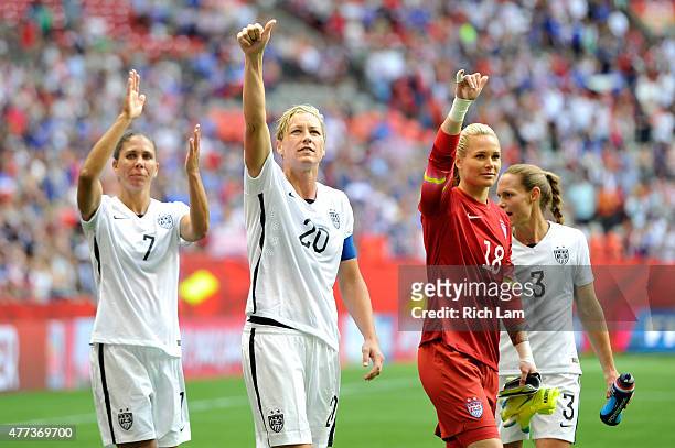 Shannon Boxx, Abby Wambach, Ashlyn Harris, and Christie Rampone of the United States celebrate with teammates after the 1-0 victory against Nigeria...