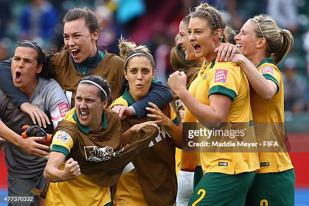 Australia celebrates, led by Lisa De Vanna of Australia, center, after their 1-1 tie against Sweden during the Women's World Cup 2015 Group D match...