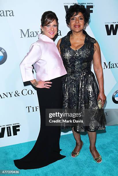 President, Women In Film, Cathy Schulman, wearing Max Mara, and actress Phylicia Rashad attend the Women In Film 2015 Crystal + Lucy Awards Presented...