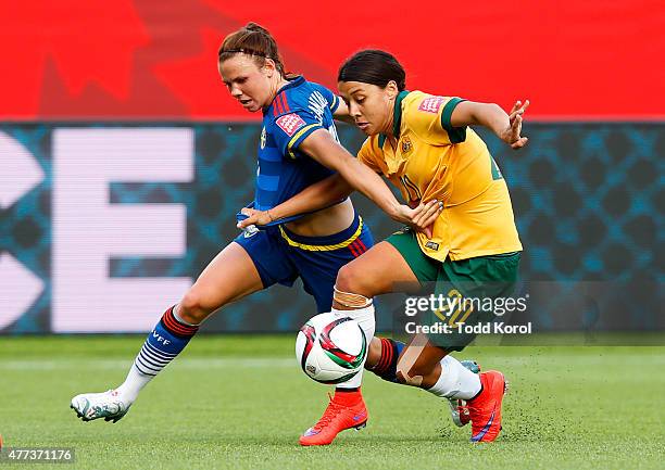 Jessica Samuelsson of Sweden and Samantha Kerr of Australia battle for the ball during the FIFA Women's World Cup Canada Group D match between...