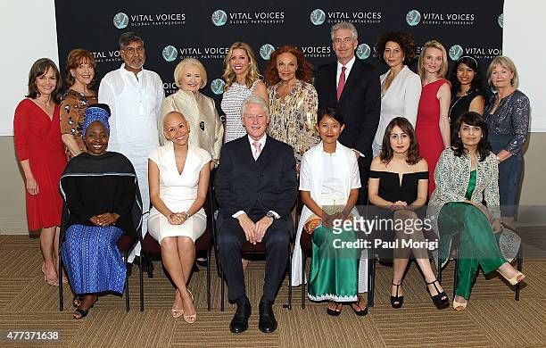 Former U.S. President Bill Clinton poses for a photo with Vital Voice Honorees and special guests including actress Sally Field , Spanx founder Sara...