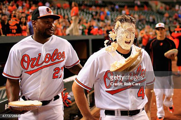 Delmon Young looks on as Chris Parmelee of the Baltimore Orioles gets hit with a pie following the Orioles 19-3 win over the Philadelphia Phillies...