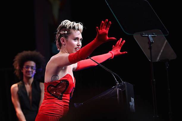 Miley Cyrus speaks onstage at the 2015 amfAR Inspiration Gala New York at Spring Studios on June 16, 2015 in New York City.