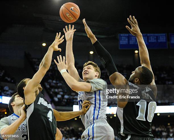 Grant Gibbs of the Creighton Bluejays shoots the ball over Josh Fortune and Kadeem Batts of the Providence Friars during their game at CenturyLink...