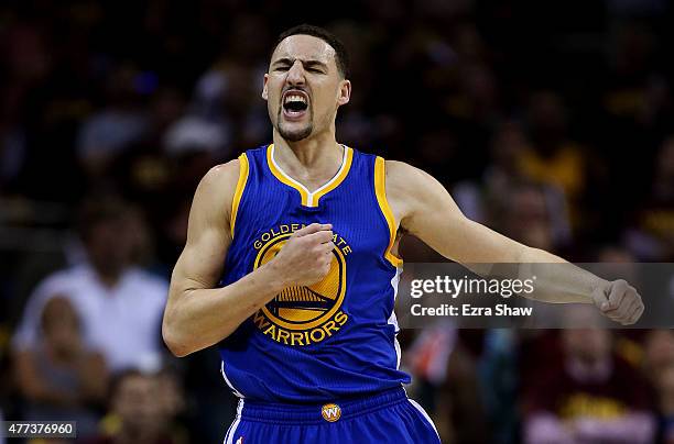 Klay Thompson of the Golden State Warriors celebrates a three pointer in the fourth quarter against the Cleveland Cavaliers during Game Six of the...