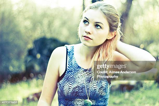 woman wearing blue dress - blue dress stock pictures, royalty-free photos & images
