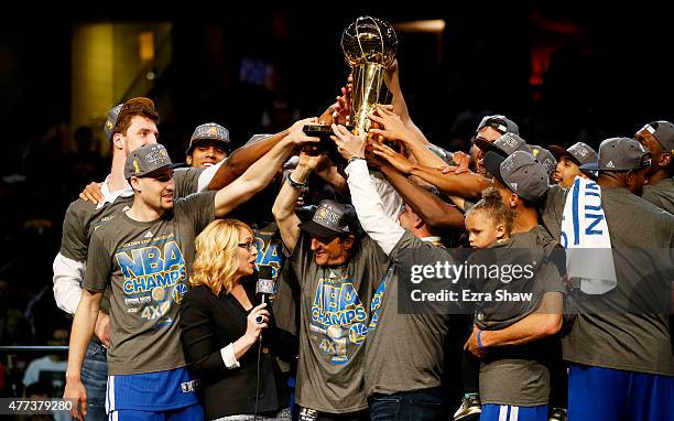 The Golden State Warriors celebrates with the Larry O'Brien NBA Championship Trophy after winning Game Six of the 2015 NBA Finals against the...