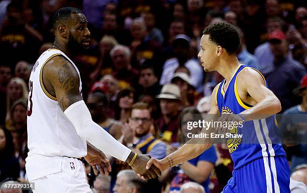 LeBron James of the Cleveland Cavaliers shakes hands with Stephen Curry of the Golden State Warriors after the Warriors defeated the Cavs 105 to 97...