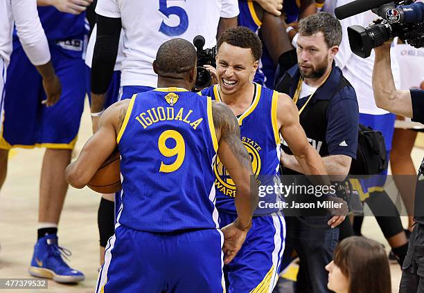 Stephen Curry and Andre Iguodala of the Golden State Warriors celebrate after defeating the Cleveland Cavaliers 105 to 97 during Game Six of the 2015...