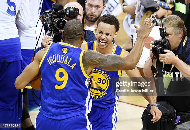 Stephen Curry and Andre Iguodala of the Golden State Warriors celebrate after defeating the Cleveland Cavaliers 105 to 97 during Game Six of the 2015...