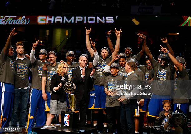 The Golden State Warriors celebrates with the Larry O'Brien NBA Championship Trophy after winning Game Six of the 2015 NBA Finals against the...