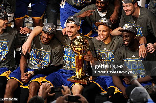 Leandro Barbosa, Klay Thompson, Stephen Curry, and Draymond Green of the Golden State Warriors celebrate winning the 2015 NBA Finals after a win...