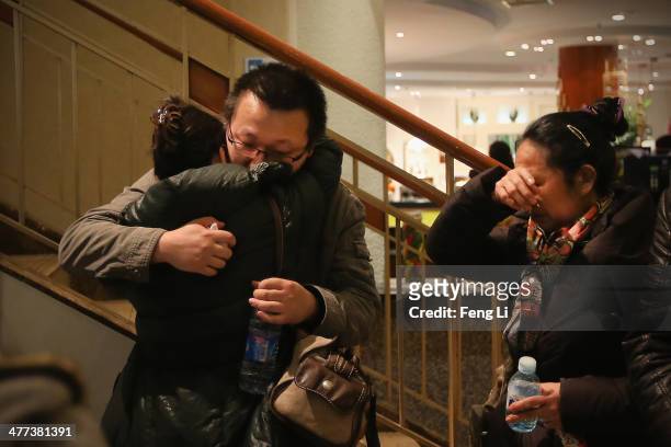 Relatives of a passenger onboard Malaysia Airlines flight MH370 at the Lido Hotel where families are gathered on March 9, 2014 in Beijing, China....