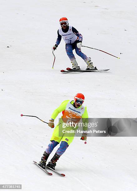 Mark Bathum of the United States with his guide Cade Yamamoto in the Men's Super G Visually Impaired during day two of Sochi 2014 Paralympic Winter...
