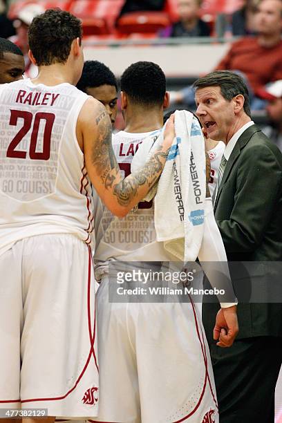 Head coach Ken Bone of the Washington State Cougars directs his players during a timeout in the second half against the UCLA Bruins during the game...