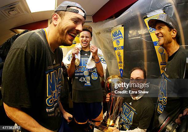 Stephen Curry and David Lee of the Golden State Warriors celebrates with team owners Peter Guber and Joe Lacob and the Larry O'Brien NBA Championship...