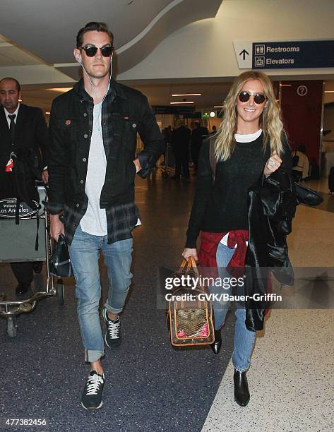 Ashley Tisdale and Christopher French are seen at LAX. On June 16, 2015 in Los Angeles, California.