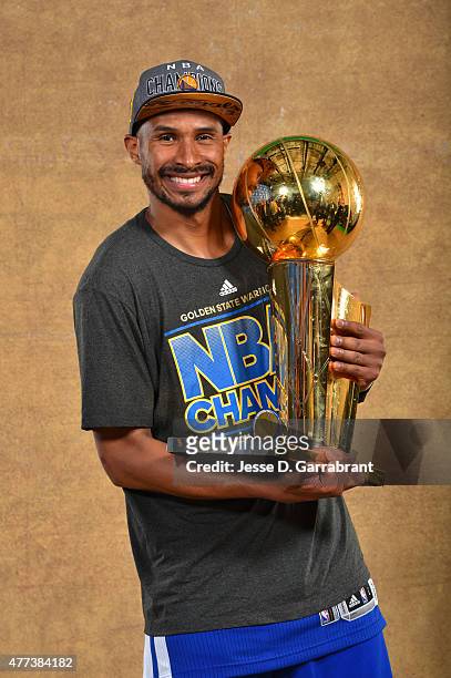 Leandro Barbosa of the Golden State Warriors poses for a portrait with the Larry O'Brien trophy after defeating the Cleveland Cavaliers in Game Six...