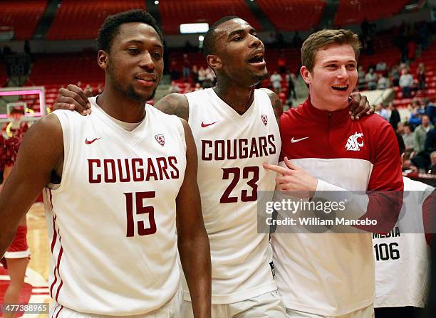 Junior Longrus, D.J. Shelton and Brett Boese of the Washington State Cougars celebrate their win over the UCLA Bruins at Beasley Coliseum on March 8,...