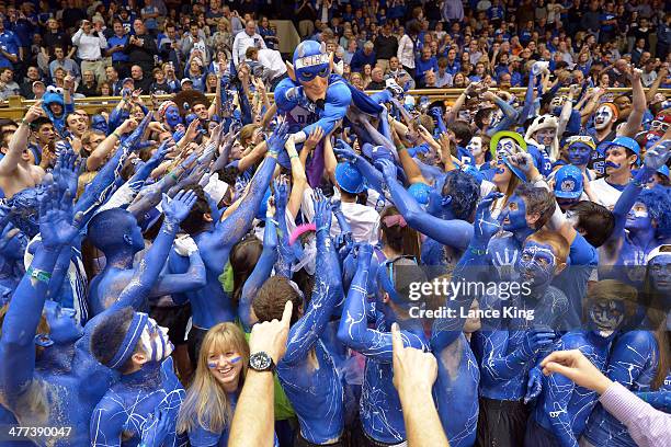 Cameron Crazies and fans of the Duke Blue Devils cheer prior to their game against the North Carolina Tar Heels as the Duke mascot crowd surfs at...