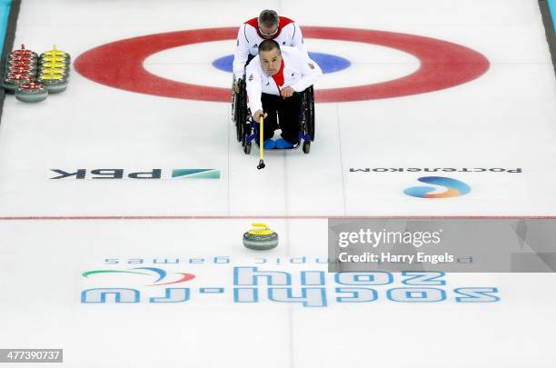 Bob McPherson of Great Britain competes in the wheelchair curling mixed round robin match between Great Britain and Sweden at the Ice Cube Curling...