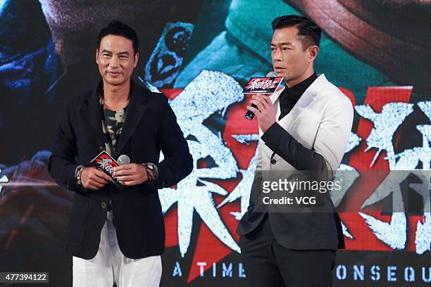 Actors Simon Yam and Louis Koo attend "A Time for Consequences" press conference on June 16, 2015 in Beijing, China.