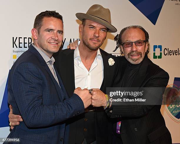 Adam Goss, his brother, singer/songwriter Matt Goss, and entertainment manager Bernie Yuman attend the 19th annual Keep Memory Alive "Power of Love...