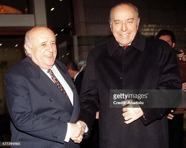 File photo dated January 29, 1999 shows that Turkey's ninth president Suleyman Demirel shakes hands with former President of Azerbaijan Heydar Aliyev...